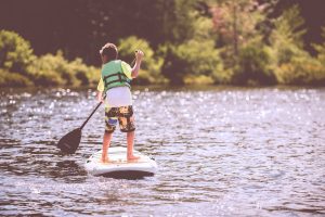 child paddle boarding
