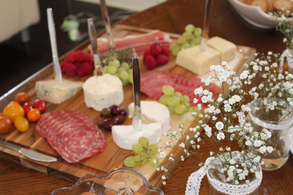 A cheese board is the perfect food offering for a shower - combine meats and cheese so there's a little something for everyone! Serve a variety of finger foods so that guests of the bridal shower can snack and chat throughout the afternoon. 